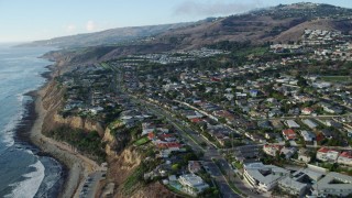 AX0161_019 - 7.6K stock footage aerial video approaching and flying over homes near coastal cliffs in San Pedro, California