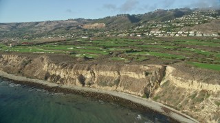 AX0161_021 - 7.6K aerial stock footage of Trump National Golf Club on coastal cliffs in Rancho Palos Verdes, California