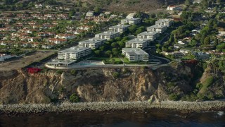 AX0161_025 - 7.6K stock footage aerial video of Palos Verdes Bay Club condo complex in Rancho Palos Verdes, California