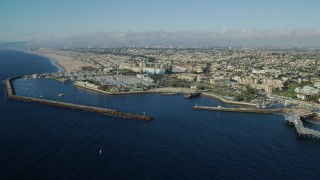 AX0161_036 - 7.6K stock footage aerial video flying by Redondo Beach, California and approach King Harbor Marina