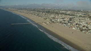 AX0161_038E - 7.6K aerial stock footage of the seaside city of Hermosa Beach, California seen from Hermosa Beach Pier