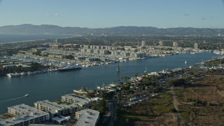 AX0161_051E - 7.6K aerial stock footage of waterfront apartment buildings and marinas in Marina Del Rey, California