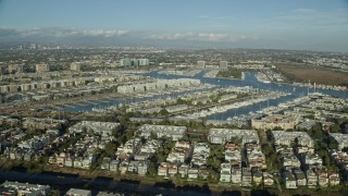 AX0161_053 - 7.6K aerial stock footage of waterfront apartment buildings overlooking marinas in Marina Del Rey, California