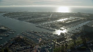 AX0161_056E - 7.6K aerial stock footage of boats at the marinas and waterfront apartment buildings in Marina Del Rey, California
