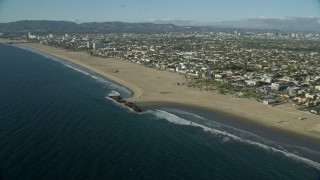 AX0161_062E - 7.6K aerial stock footage of Windward Plaza and the Muscle Beach area of Venice Beach in Venice, California