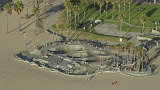 AX0161_064E - 7.6K aerial stock footage of Venice Skate Park on Venice Beach in Venice, California