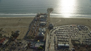 AX0161_076E - 7.6K aerial stock footage flying over Santa Monica Pier in Santa Monica, California