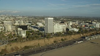 AX0161_082 - 7.6K aerial stock footage of office Buildings beside the Pacific Coast Highway in Santa Monica, California