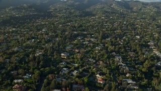 AX0161_086 - 7.6K aerial stock footage flying by mansions in Brentwood, California