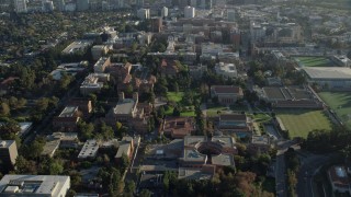 AX0161_090 - 7.6K stock footage aerial video of an orbit of campus buildings at College in Los Angeles, California