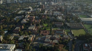 AX0161_090E - 7.6K aerial stock footage of an orbit of campus buildings at College in Los Angeles, California