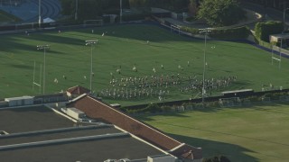 AX0161_092 - 7.6K aerial stock footage of the College band practice on Intramural Field in Los Angeles, California