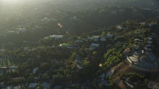 AX0161_102 - 7.6K aerial stock footage of a reverse view of hillside mansions in Beverly Glen, Los Angeles, California