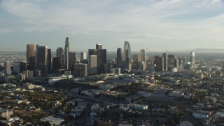 AX0162_002 - 7.6K stock footage aerial video approaching the skyline in Downtown Los Angeles, California
