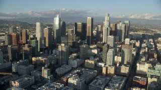 AX0162_007E - 7.6K aerial stock footage of Oceanwide Plaza and a view of tall skyscrapers in Downtown Los Angeles, California
