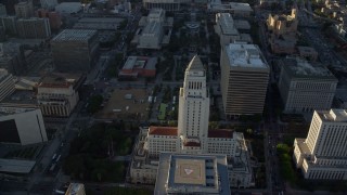 AX0162_010 - 7.6K stock footage aerial video approaching and orbiting Los Angeles City Hall in Downtown Los Angeles, California