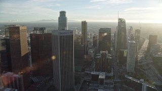 AX0162_011E - 7.6K aerial stock footage of skyscrapers around the Westin Bonaventure Hotel in Downtown Los Angeles, California