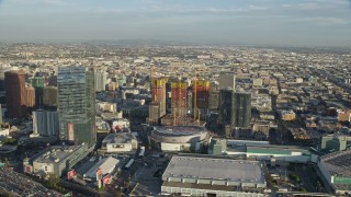 AX0162_015 - 7.6K stock footage aerial video of the Ritz-Carlton Hotel, Staples Center, and Oceanwide Plaza in Downtown Los Angeles, California