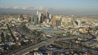 AX0162_016E - 7.6K aerial stock footage of Downtown Los Angeles, California seen from the 10 / 110 interchange