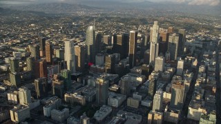 AX0162_039E - 7.6K aerial stock footage flying over Aon Center and approach heavy 110 traffic in Downtown Los Angeles, California