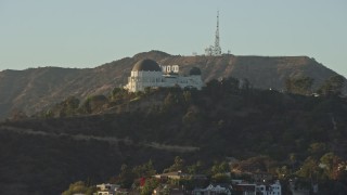 AX0162_048E - 7.6K aerial stock footage of Griffith Observatory with the Hollywood Sign in the background in Los Angeles, California