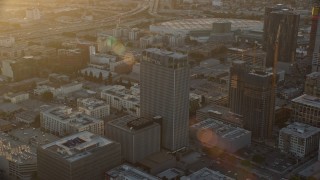 AX0162_067 - 7.6K aerial stock footage approaching Transamerica Center at sunset in Downtown Los Angeles, California