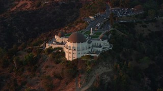 AX0162_099 - 7.6K aerial stock footage approaching Griffith Observatory in Los Angeles, California at twilight