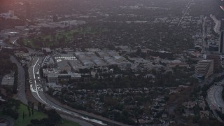 AX0162_110 - 7.6K aerial stock footage of the Warner Bros Studio lot at sunset in Burbank, California 