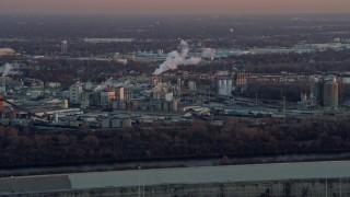 AX0163_0015 - 4K aerial stock footage of a factory at sunset in Bedford Park, Illinois