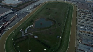 AX0163_0019 - 4K aerial stock footage of flying over a race track at sunset in Stickney, Illinois