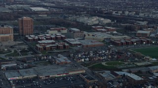AX0163_0021 - 4K aerial stock footage of approaching Cook County Department of Corrections complex at sunset in West Side Chicago, Illinois