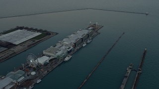 AX0163_0034 - 4K aerial stock footage of Navy Pier at sunset in Chicago, Illinois