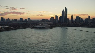 AX0163_0044 - 4K aerial stock footage flyby Shedd Aquarium, city skyline at twilight, Downtown Chicago, Illinois