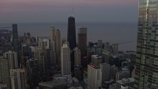 AX0163_0052 - 4K aerial stock footage fly past Trump Tower to reveal John Hancock Center at twilight in Downtown Chicago, Illinois