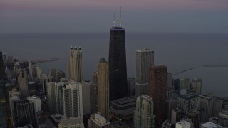 AX0163_0053 - 4K aerial stock footage approach John Hancock Center at twilight in Downtown Chicago, Illinois