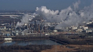AX0165_0001 - 4K aerial stock footage of flying by an oil refinery in Romeoville, Illinois