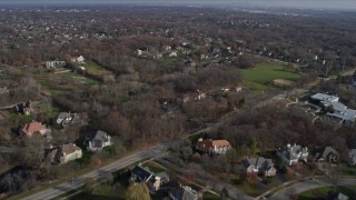 AX0165_0006 - 4K aerial stock footage of flying over upscale homes in Burr Ridge, Illinois
