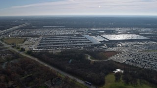 AX0165_0009 - 4K aerial stock footage of flying by a massive UPS warehouse in Hodgkins, Illinois