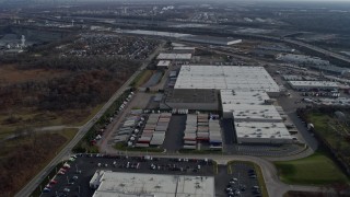 AX0165_0010 - 4K aerial stock footage approach and pass warehouse buildings in Hodgkins, Illinois