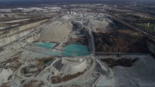 AX0165_0011 - 4K aerial stock footage of flying over a quarry in Hodgkins, Illinois