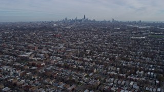 AX0165_0015 - 4K aerial stock footage of flying over West Side suburban neighborhoods toward Downtown Chicago, Illinois skyline