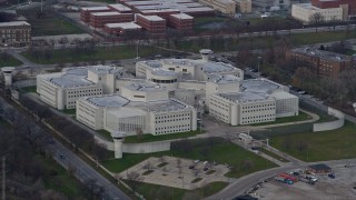 AX0165_0018 - 4K aerial stock footage of circling the Cook County Jail in West Side Chicago, Illinois skyline