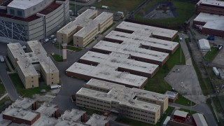 AX0165_0021 - 4K aerial stock footage of orbiting buildings at the Cook County Jail complex in West Side Chicago, Illinois skyline