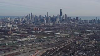 AX0165_0023 - 4K aerial stock footage of approaching the Downtown Chicago, Illinois skyline from the West Side