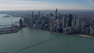 AX0165_0032 - 4K aerial stock footage of tall, waterfront skyscrapers and Navy Pier in Downtown Chicago, Illinois