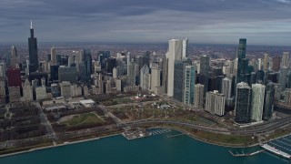 AX0165_0038 - 4K aerial stock footage approach Grant Park and skyscrapers in Downtown Chicago, Illinois