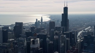 AX0165_0042 - 4K aerial stock footage of iconic Willis Tower and high-rises in Downtown Chicago, Illinois