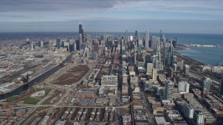AX0165_0049 - 4K aerial stock footage of approaching the Downtown Chicago skyscrapers, Illinois, from South Side