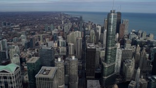 AX0165_0052 - 4K aerial stock footage of following State Street past Downtown Chicago skyscrapers, Illinois