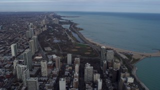AX0165_0054 - 4K aerial stock footage fly past Downtown Chicago skyscrapers, Illinois, reveal Lincoln Park